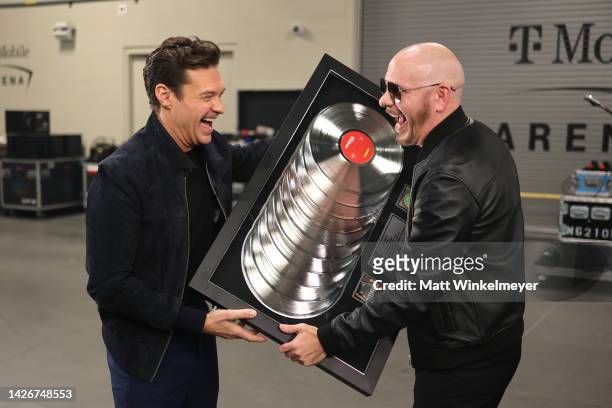 Ryan Seacrest and Pitbull attend the 2022 iHeartRadio Music Festival at T-Mobile Arena on September 23, 2022 in Las Vegas, Nevada.