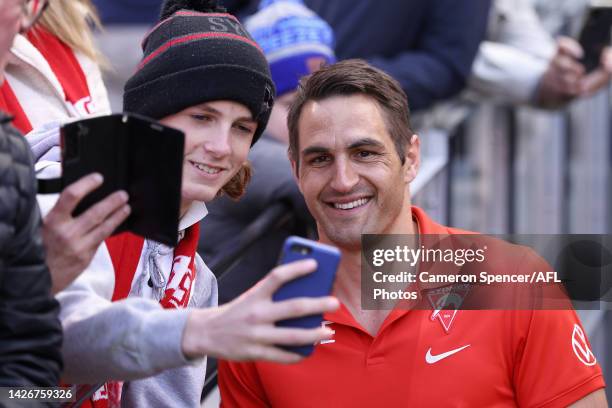 Injured Swans player Josh P. Kennedy walks up the Swans race ahead of the 2022 AFL Grand Final match between the Geelong Cats and the Sydney Swans at...