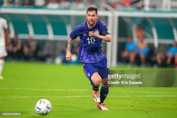 Forward Lionel Messi of Argentina runs with the ball during the international friendly match between Honduras and Argentina at Hard Rock Stadium on...
