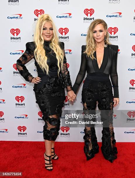 Tori Spelling and Jennie Garth arrive at the 2022 iHeartRadio Music Festival at T-Mobile Arena on September 23, 2022 in Las Vegas, Nevada.