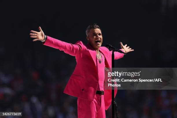 Robbie Williams performs during the 2022 AFL Grand Final match between the Geelong Cats and the Sydney Swans at the Melbourne Cricket Ground on...