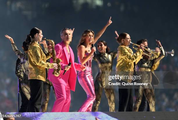 Robbie Williams and Delta Goodrem perform during the 2022 AFL Grand Final match between the Geelong Cats and the Sydney Swans at the Melbourne...