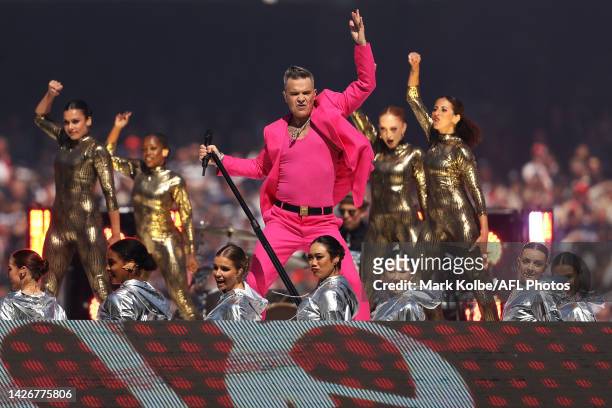 Robbie Wiliams performs in the pre-game entertainment before the 2022 AFL Grand Final match between the Geelong Cats and the Sydney Swans at the...