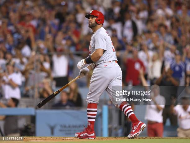 Albert Pujols of the St. Louis Cardinals watches his 700th career homerun, a three run homerun to take a 5-0 lead over the Los Angeles Dodgers,...