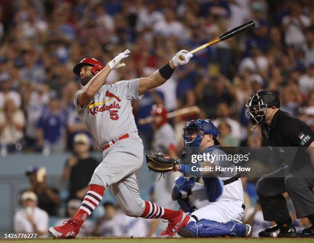 Albert Pujols of the St. Louis Cardinals hits his 700th career homerun in front of Will Smith of the Los Angeles Dodgers, a three run homerun to take...