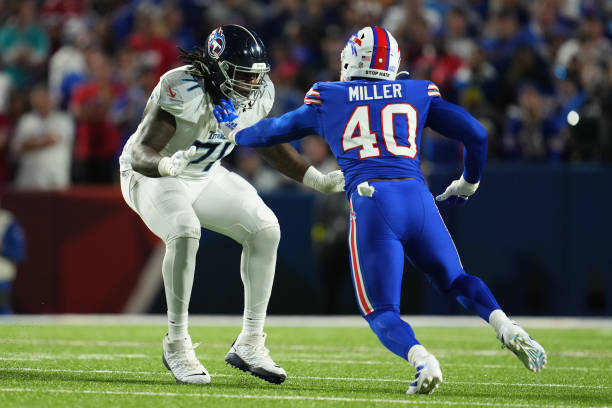 Dennis Daley of the Tennessee Titans defends against Von Miller of the Buffalo Bills at Highmark Stadium on September 19, 2022 in Orchard Park, New...