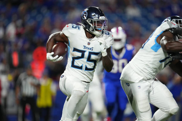 Hassan Haskins of the Tennessee Titans runs the ball against the Buffalo Bills at Highmark Stadium on September 19, 2022 in Orchard Park, New York.
