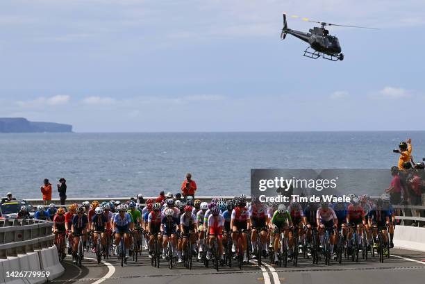 General view of the peloton compete passing through Lawrence Hargrave Drive road during the 95th UCI Road World Championships 2022 - Women Elite Road...