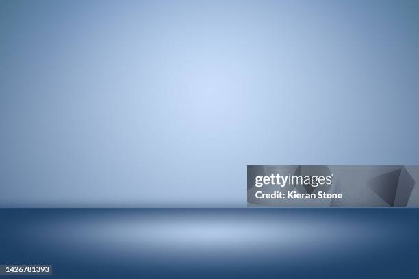 simple blue studio back drop - background studio stock pictures, royalty-free photos & images