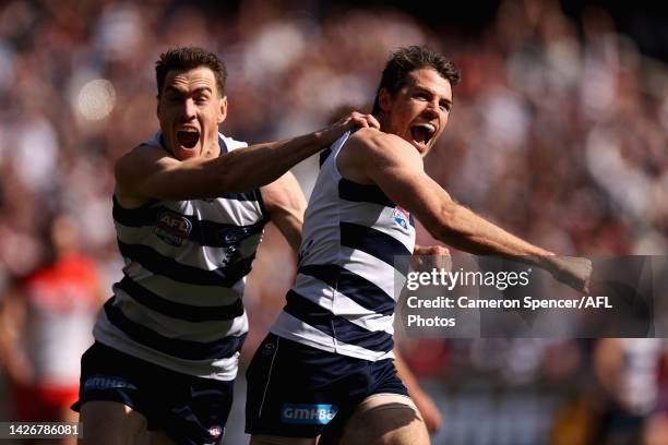 Isaac Smith of the Cats celebrates kicking a goal with Jeremy Cameron of the Cats during the 2022 AFL Grand Final match between the Geelong Cats and...