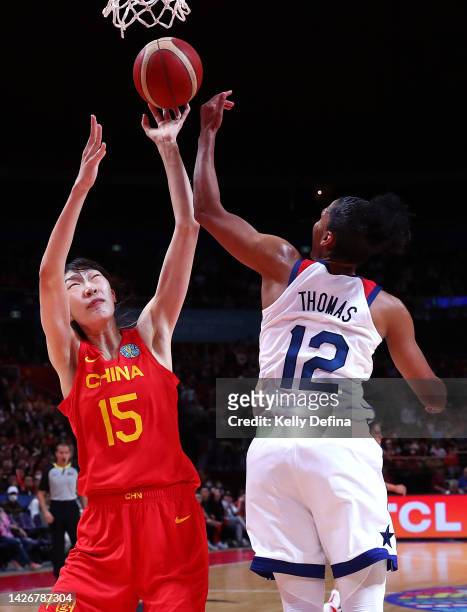 Xu Han of China competes for the ball against Alyssa Thomas of the United States during the 2022 FIBA Women's Basketball World Cup Group A match...