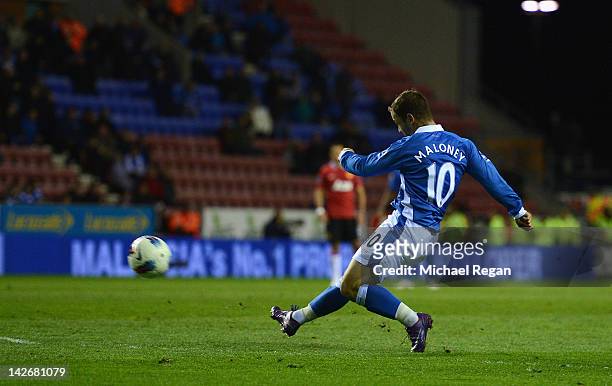 Shaun Maloney of Wigan scores to make it 1-0 during the Barclays Premier League match between Wigan Athletic and Manchester United at the DW Stadium...