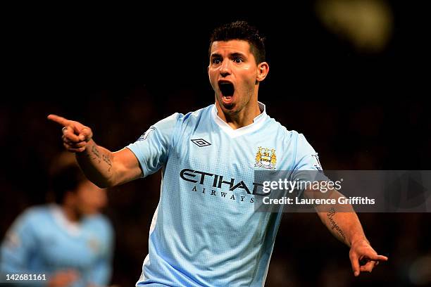 Sergio Aguero of Manchester City celebrates scoring his team's second goal during the Barclays Premier League match between Manchester City and West...