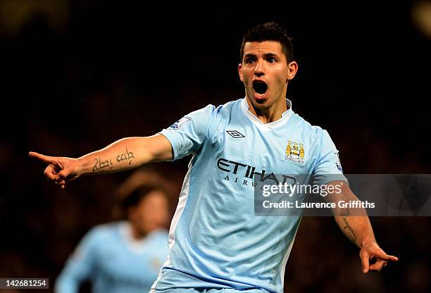 Sergio Aguero of Manchester City celebrates scoring his team's second goal during the Barclays Premier League match between Manchester City and West...