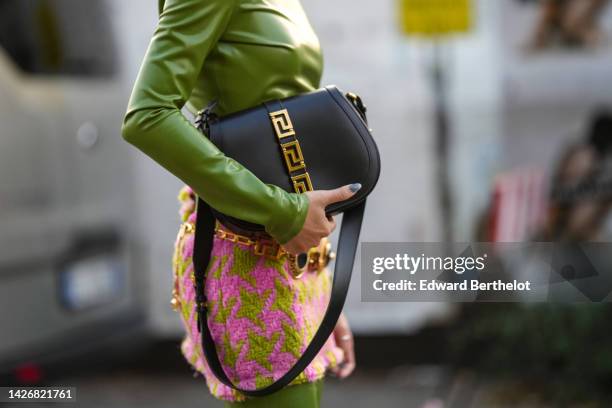 Yoyo Cao wears a green shiny vinyl turtleneck / long sleeves / long jumpsuit, a green and pink houndstooth print pattern tweed short skirt from...