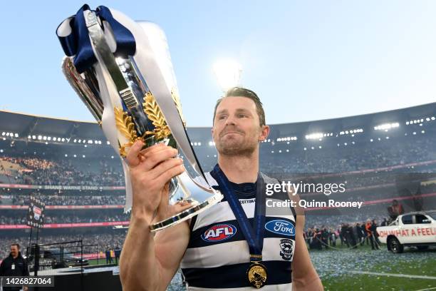 Patrick Dangerfield of the Cats celebrates with the premiership trophy after winning the 2022 AFL Grand Final match between the Geelong Cats and the...