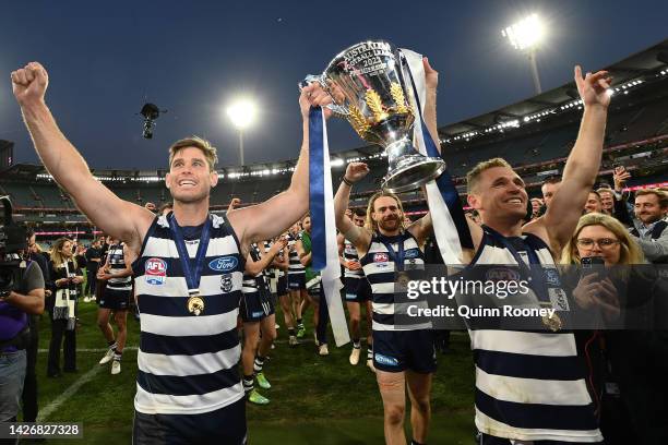 Tom Hawkins and Joel Selwood of the Cats hold aloft the premiership cup after winning the 2022 AFL Grand Final match between the Geelong Cats and the...