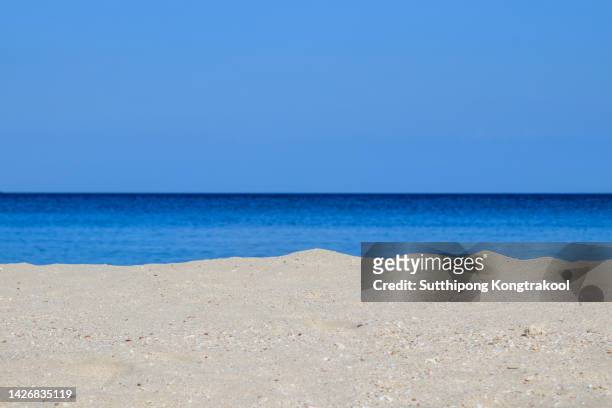 tropical beach at phuket thailand. yellow warm sand and summer sea with sky and free space - surf casting stock pictures, royalty-free photos & images