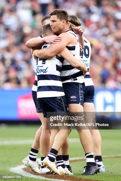 Joel Selwood of the Geelong Cats is embraced by Tom Hawkins of the Geelong Cats after kicking a goal during the 2022 AFL Grand Final match between...