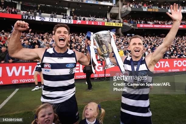 Tom Hawkins of the Cats and Joel Selwood of the Cats celebrate with the Premiership Cup after winning the 2022 AFL Grand Final match between the...