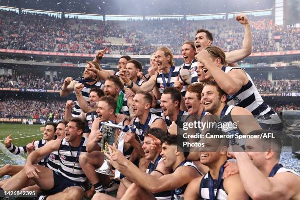 The Cats celebrate with the Premiership Cup after winning the 2022 AFL Grand Final match between the Geelong Cats and the Sydney Swans at the...