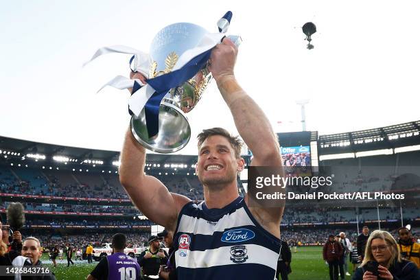 Tom Hawkins of the Cats holds aloft the premiership cup after winning the 2022 AFL Grand Final match between the Geelong Cats and the Sydney Swans at...