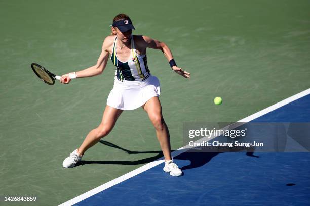 Ekaterina Alexandrova of Russia hits a shot against Tatjana Maria of Germany during the women's semi final match of the Hana Bank Korea Open...