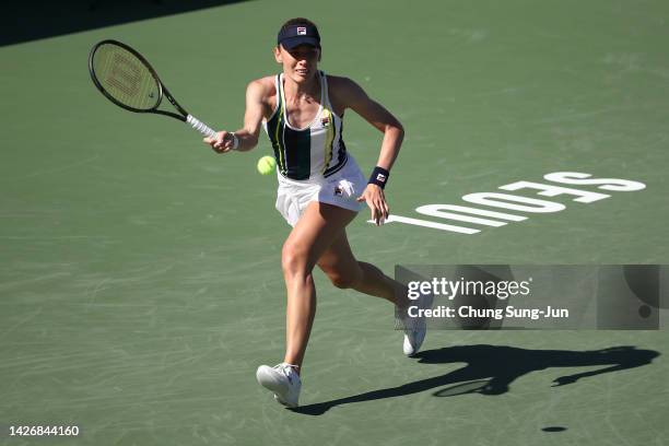 Ekaterina Alexandrova of Russia hits a shot against Tatjana Maria of Germany during the women's semi final match of the Hana Bank Korea Open...