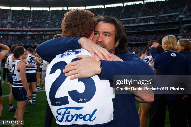 Cats head coach Chris Scott hugs Gary Rohan of the Cats after winning the 2022 AFL Grand Final match between the Geelong Cats and the Sydney Swans at...