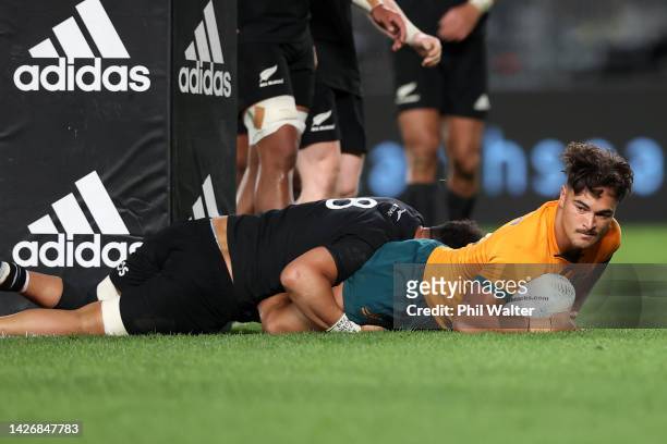 Jordan Petaia of the Wallabies scores a try during The Rugby Championship and Bledisloe Cup match between the New Zealand All Blacks and the...