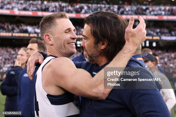 Joel Selwood of the Cats and Cats head coach Chris Scott celebrate winning the 2022 AFL Grand Final match between the Geelong Cats and the Sydney...