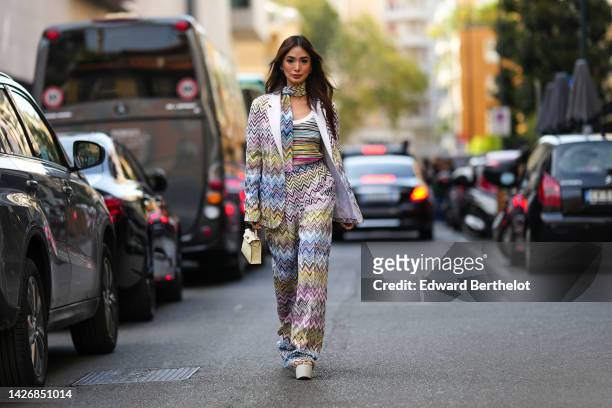 Heart Evangelista wears a flashy multicolored striped print pattern scarf from Missoni, a matching flashy multicolored striped print pattern tank-top...