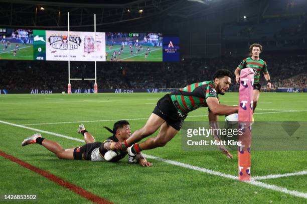Taane Milne of the Rabbitohs is tackled during the NRL Preliminary Final match between the Penrith Panthers and the South Sydney Rabbitohs at Accor...