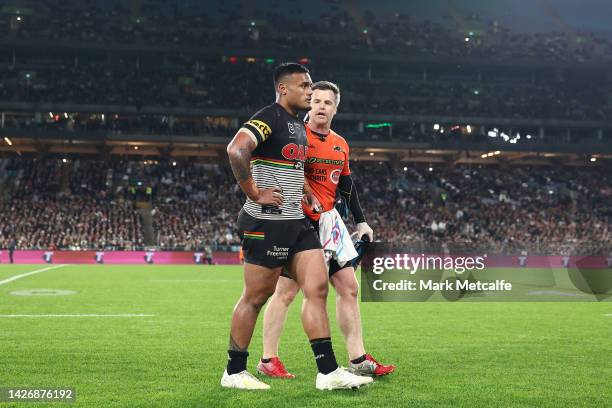 Spencer Leniu of the Panthers is taken off the field after a head-high tackle by Taane Milne of the Rabbitohs during the NRL Preliminary Final match...