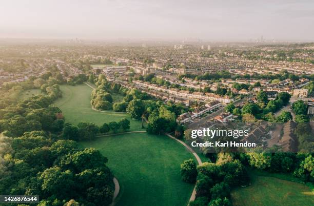 london skyline - an aerial view of suburban streets and parkland in north london - southgate stock pictures, royalty-free photos & images