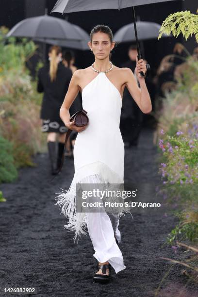 Model walks the runway of the Jil Sander Fashion Show during the Milan Fashion Week Womenswear Spring/Summer 2023 on September 24, 2022 in Milan,...