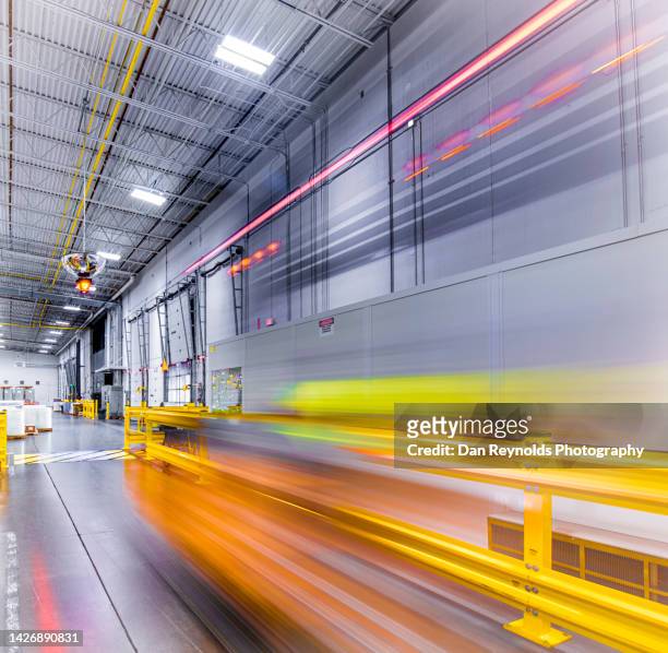 futuristic industrial warehouse fork lift as abstract - take control imagens e fotografias de stock