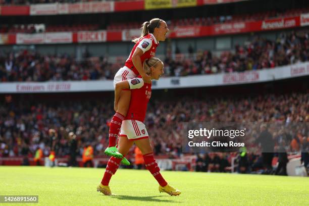 Beth Mead of Arsenal celebrates with teammate Katie McCabe after scoring their team's first goal during the FA Women's Super League match between...