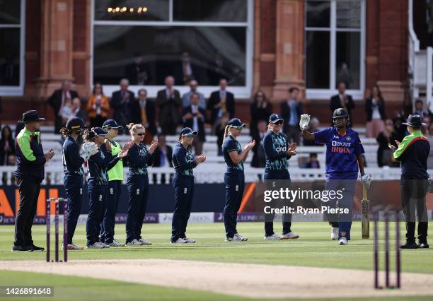 Jhulan Goswami of India walks out to bat in her final match as England players form a guard of honour during the 3rd Royal London ODI between England...