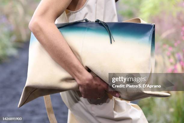 Model, bag detail, walks the runway of the Jil Sander Fashion Show during the Milan Fashion Week Womenswear Spring/Summer 2023 on September 24, 2022...