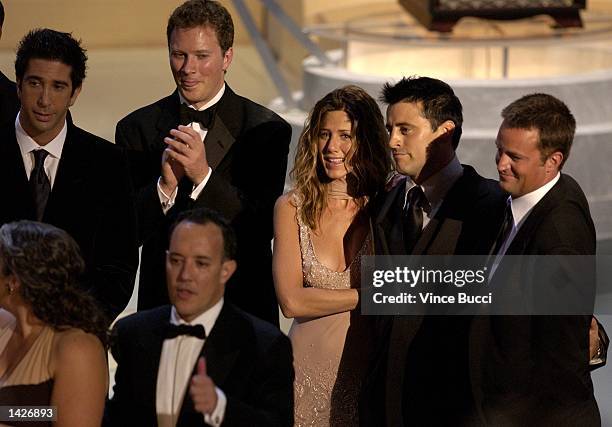 The writers and cast of Friends gather on stage to accept their award for "Outstanding Comedy Series" during the 54th Annual Primetime Emmy Awards at...