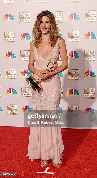 Actress Jennifer Aniston poses with her Outstanding Lead Actress in a Comedy Series award for "Friends" backstage during the 54th Annual Primetime...