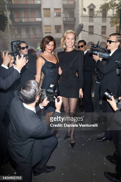 Helena Christensen and Eva Herzigova are seen on the front row of the Dolce & Gabbana Fashion Show during the Milan Fashion Week Womenswear...