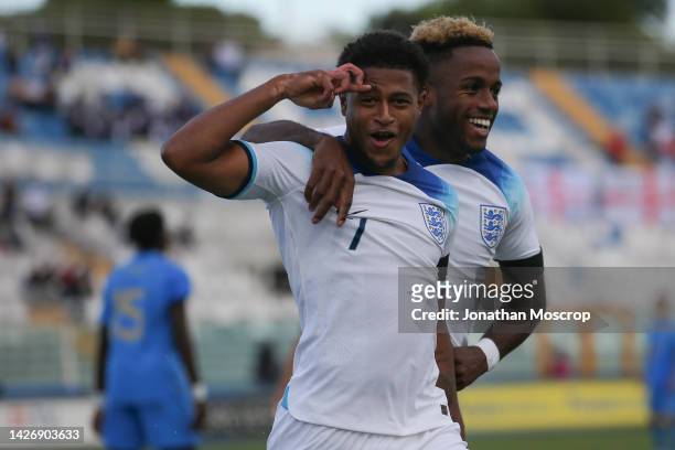 Rhian Brewster of England celebrates with team mate Ryan Sessegnon after scoring his second goal to give the side a 2-0 lead during the Friendly...