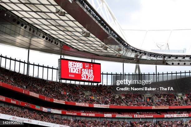 An LED board inside the stadium displays a message reading "record ticket sales" during the FA Women's Super League match between Arsenal and...