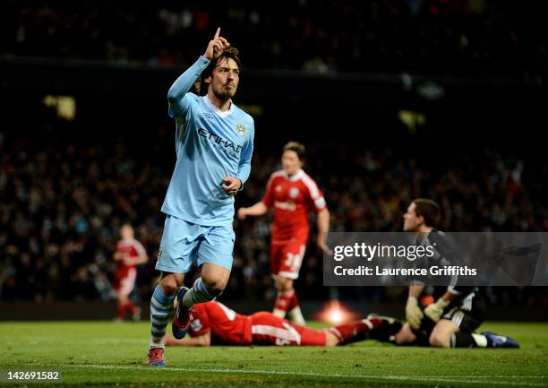 David Silva of Manchester City celebrates scoring his team's fourth goal during the Barclays Premier League match between Manchester City and West...