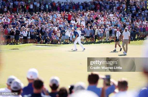 Jordan Spieth of the United States Team reacts on the 15th green as a gallery of fans look on during Saturday morning foursomes on day three of the...