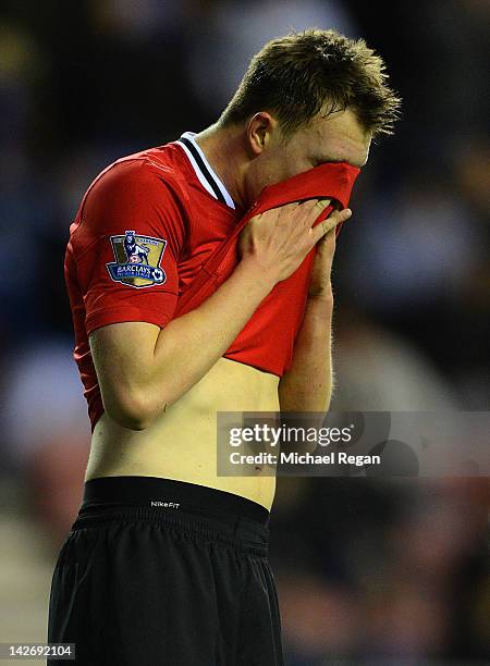 Phil Jones of Manchester United looks dejected during the Barclays Premier League match between Wigan Athletic and Manchester United at the DW...