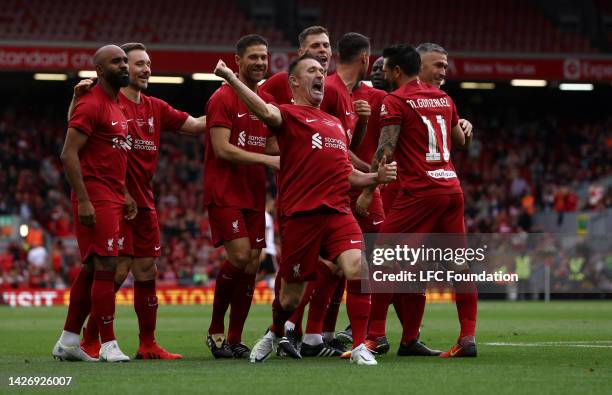 Robbie Keane of Liverpool celebrates after their team's first goal scored by Mark Gonzalez during the Legends of the North match between Liverpool...