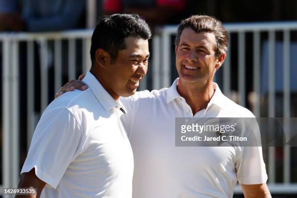 Hideki Matsuyama of Japan and Adam Scott of Australia and the International Team react after winning their match 3&2 against Cameron Young and Collin...